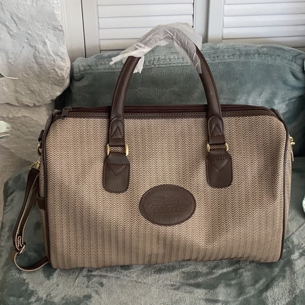 Heartland USA Traveler Brown and tan travel bag with handles and shoulder strap